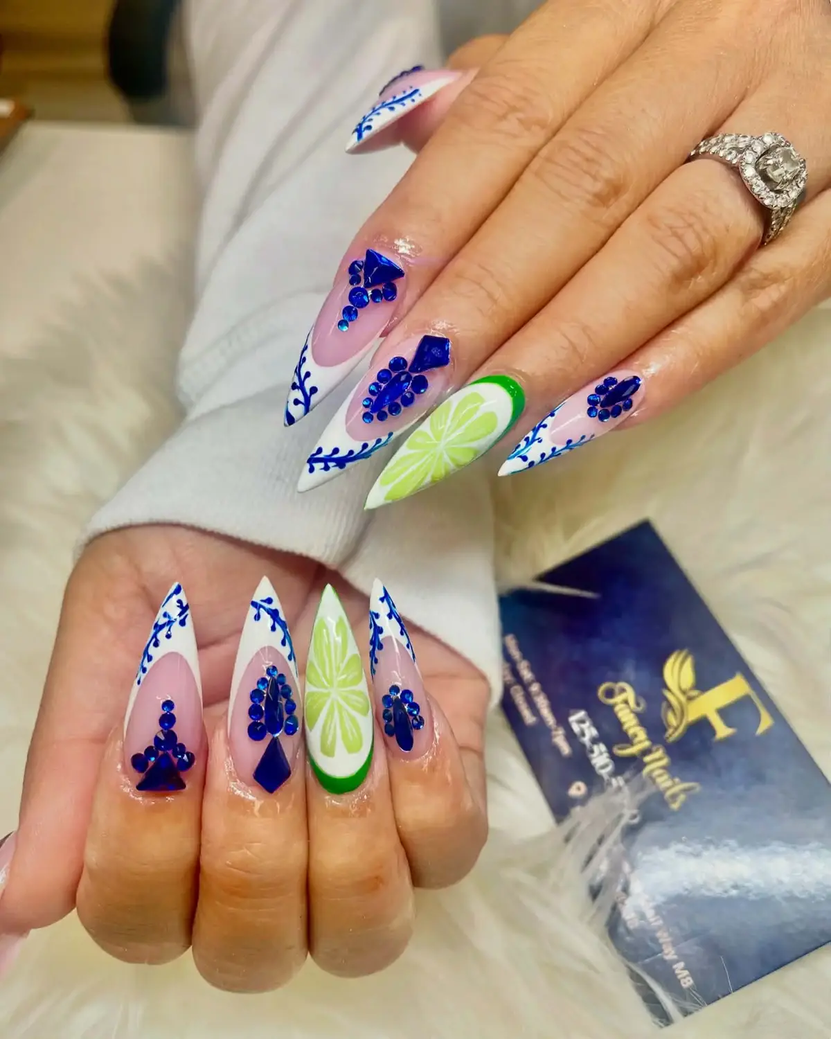Blue, white and lime citrus nail art with crystal accents